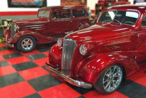 Two red antique cars shined up