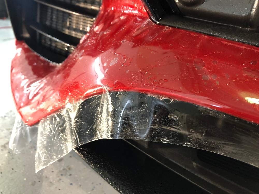 Red bumper covered in plastic